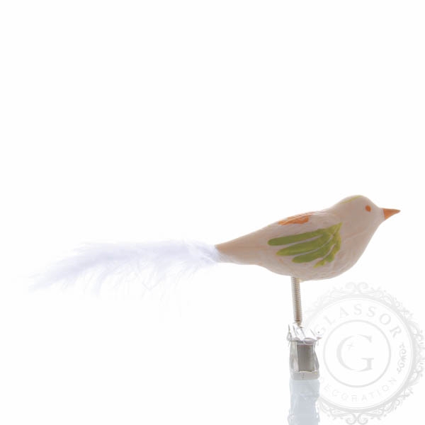 Creamy eggshell bird with orange rose flower and green leaves 