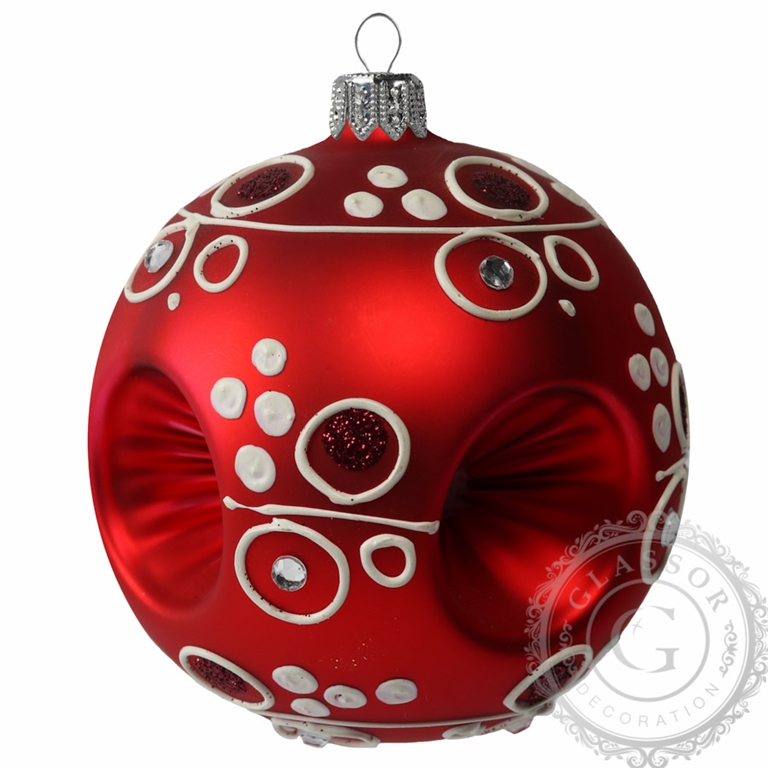 Red glass ball with white décor and punctures