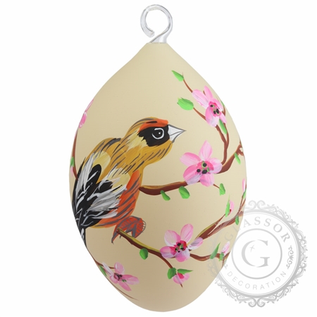 Glass dark yellow Easter egg with painted bird