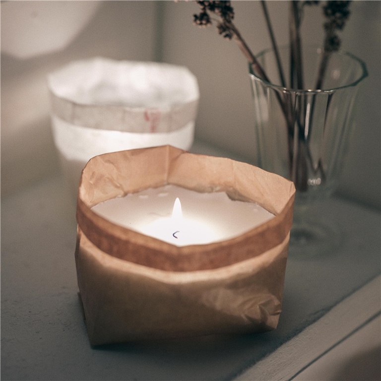 Garden candle in a paper bag