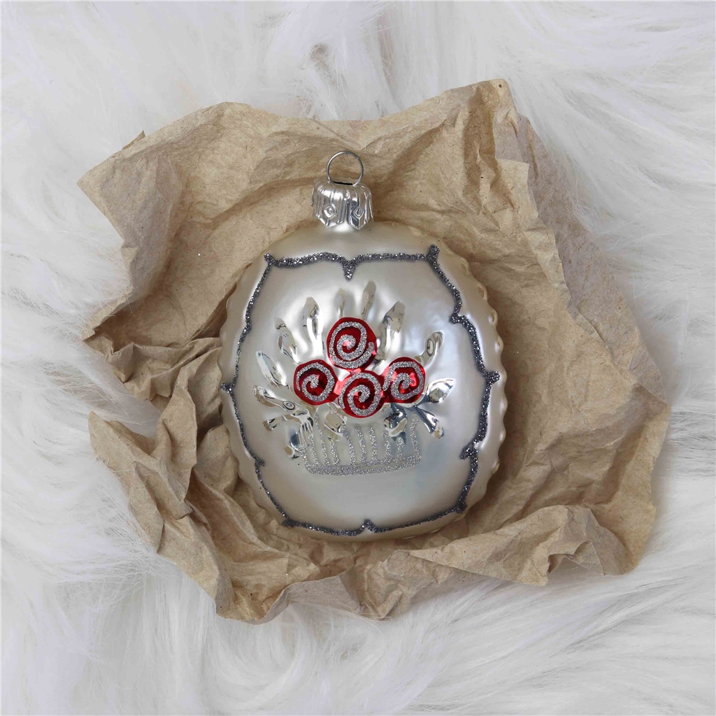 COLLECTIBLE white medallion with red flower