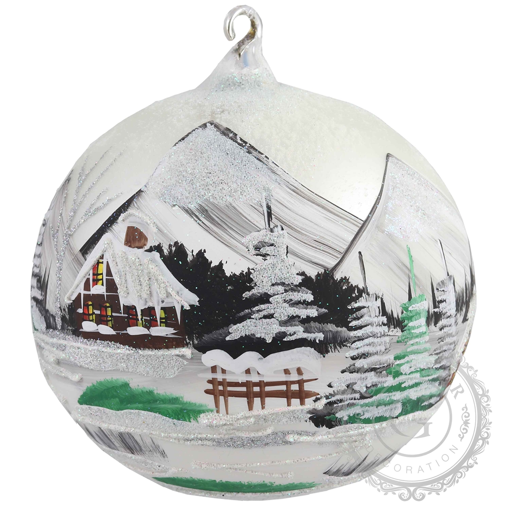 Glass bauble with mountain cottage motif