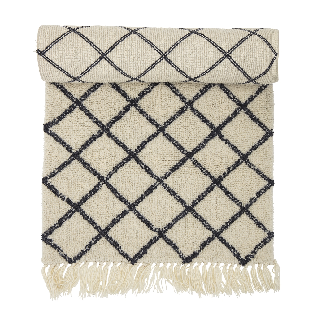 Woolen carpet with a geometric pattern