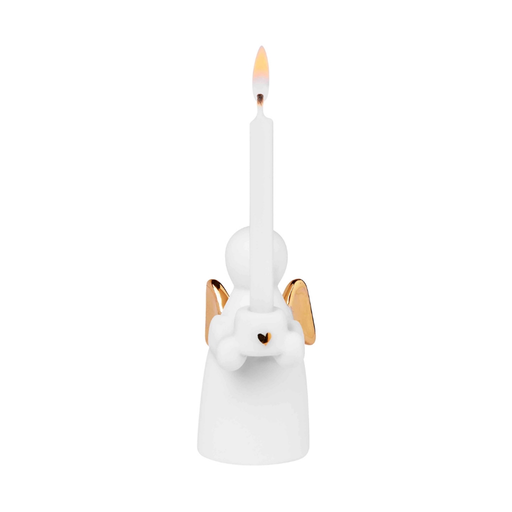 Porcelain guardian angel with a candle