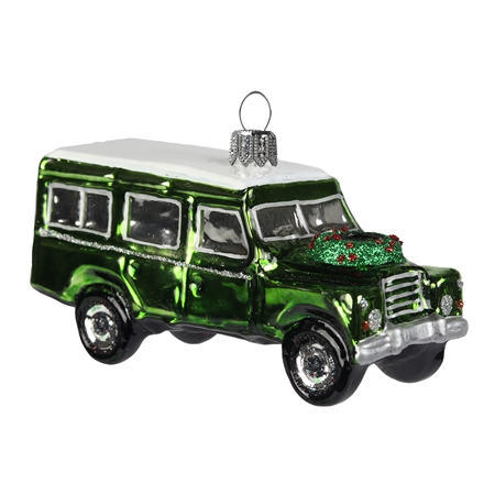 Green off-road car with Christmas wreath
