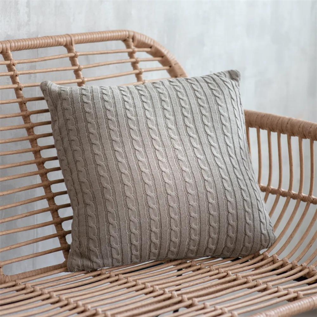 Gray pillow with braid pattern