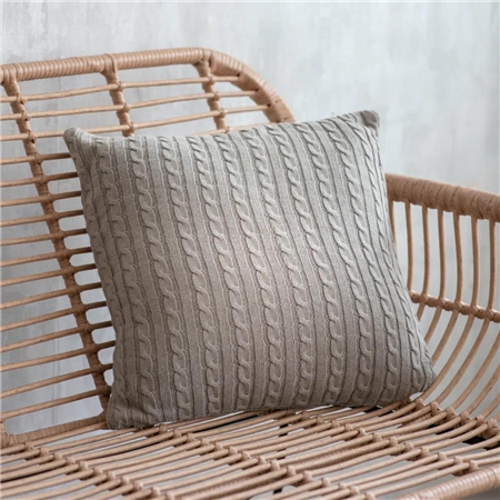 Gray pillow with braid pattern