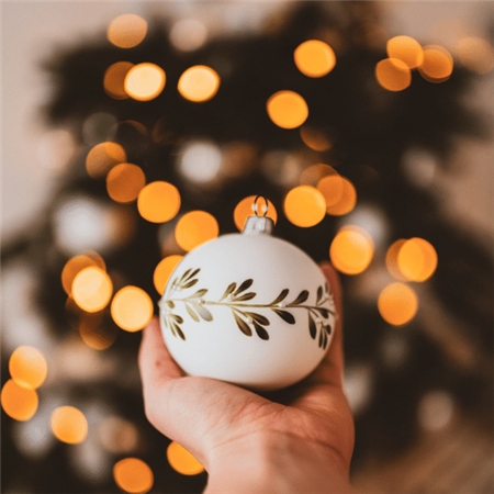 Porcelain white ball with mistletoe decor