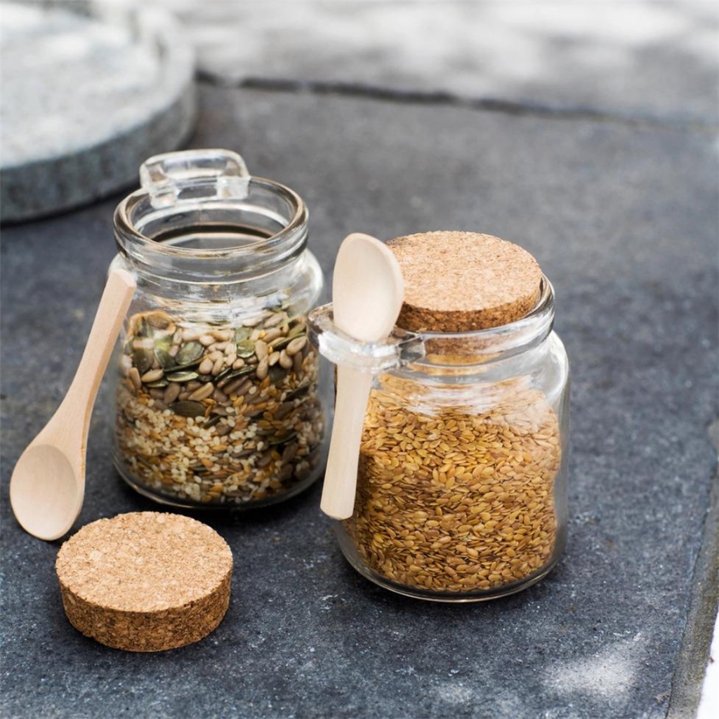 Set of food jars with wooden spoons