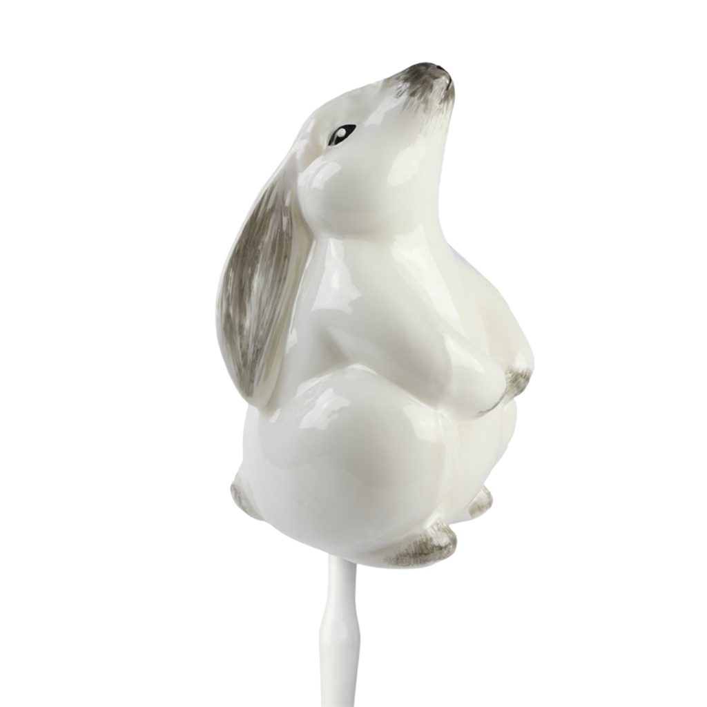 Glass white hare a stick