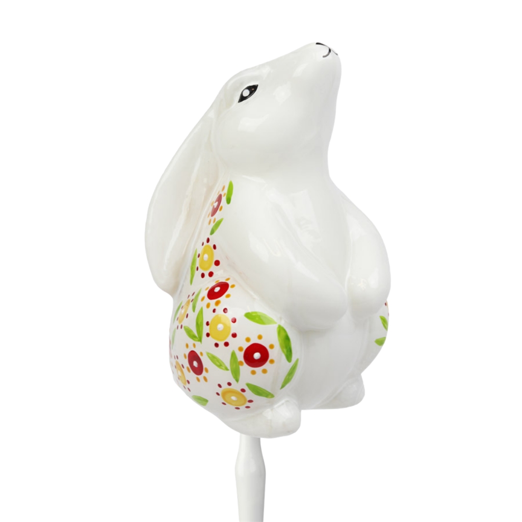 White hare with spring décor on a stick