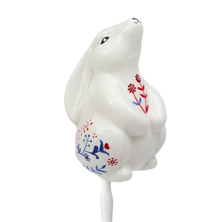 White hare with folk décor on a stick