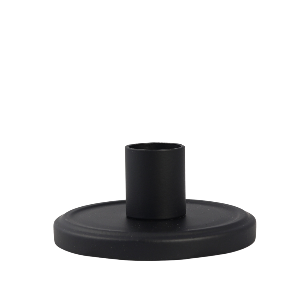 Black conical candle holder on a jar lid