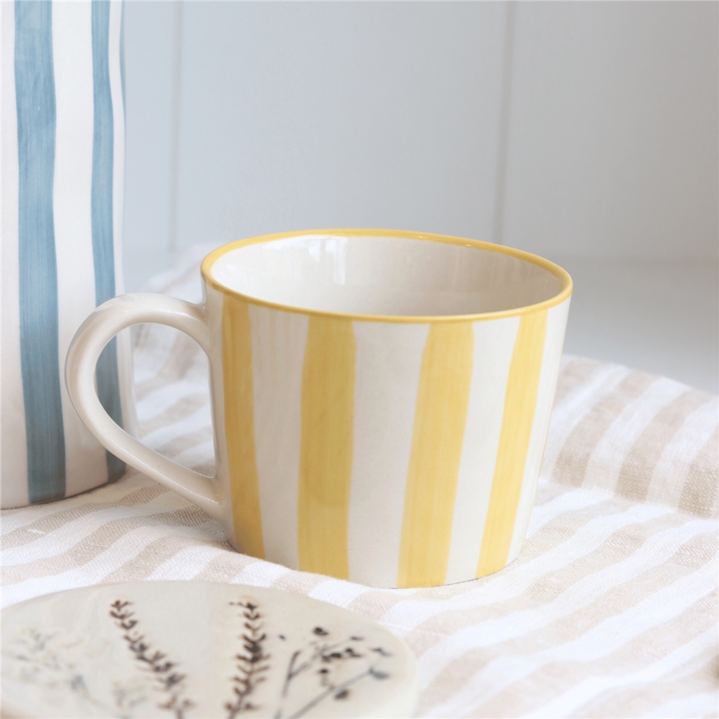Glazed mug with yellow stripes