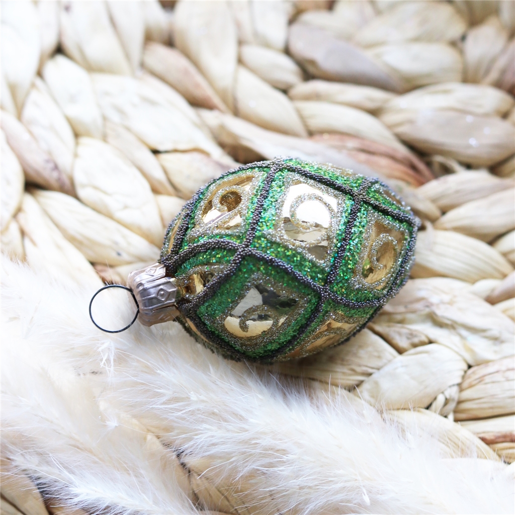 Green-gold glass Easter egg with bead décor
