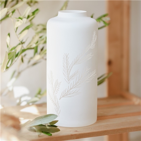 Tall white glass vase with twig decoration