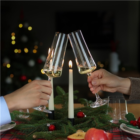 Set of champagne bottles with mistletoe decor