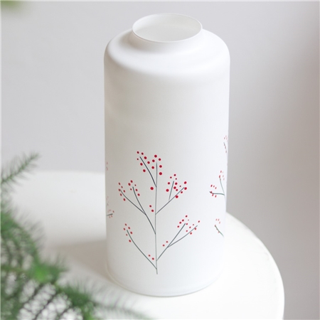 White glass vase with holly decoration