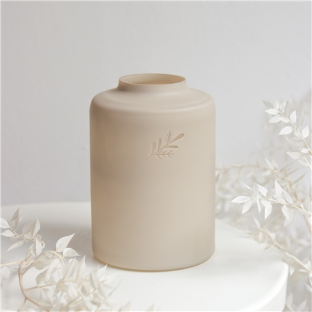 Low beige glass vase with twig decor