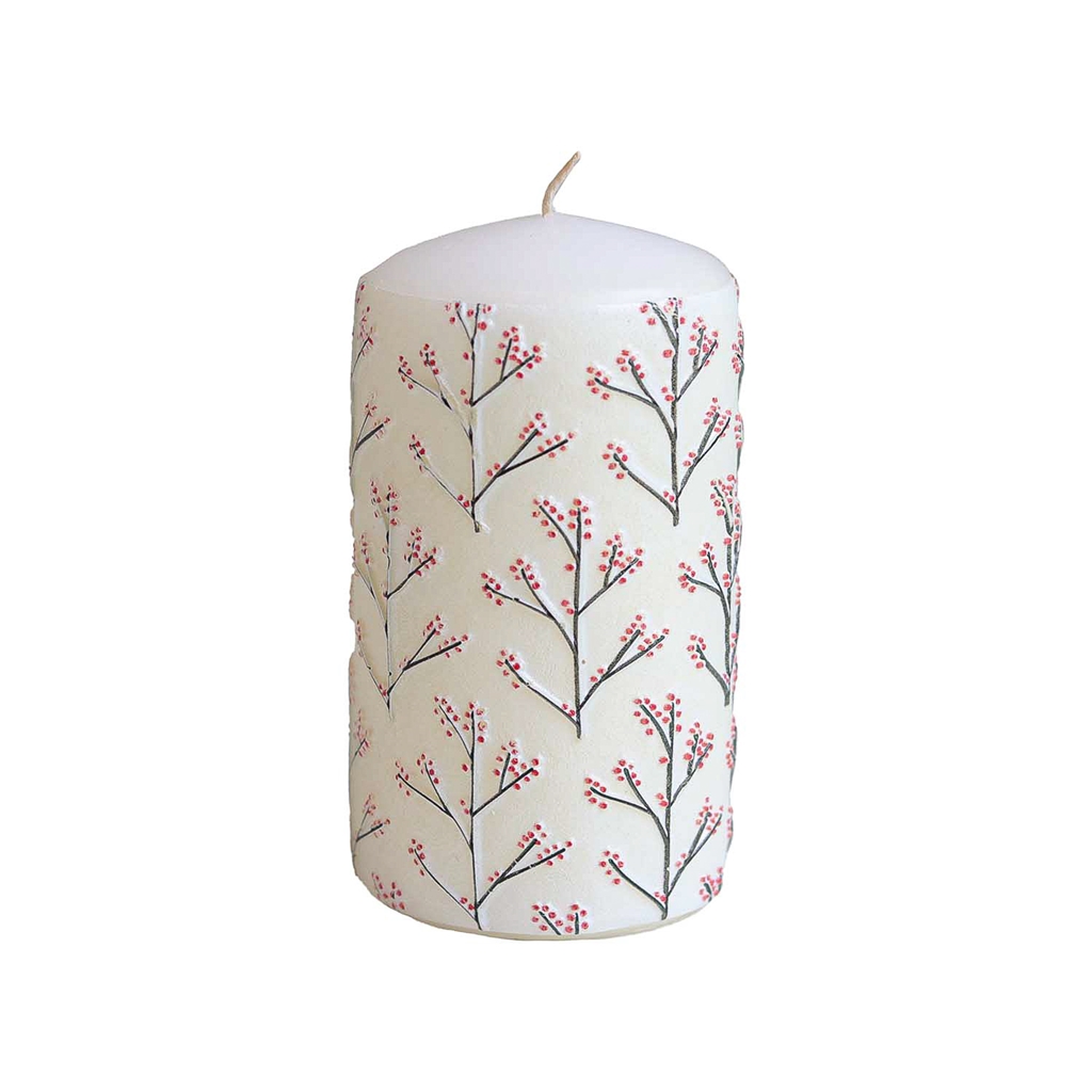 White candle with holly decor