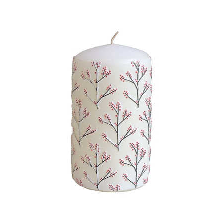 White candle with holly decor