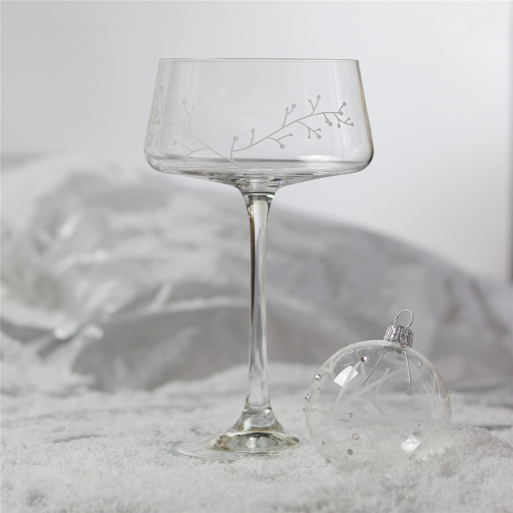 A set of clear cocktail glasses with a frosty decor