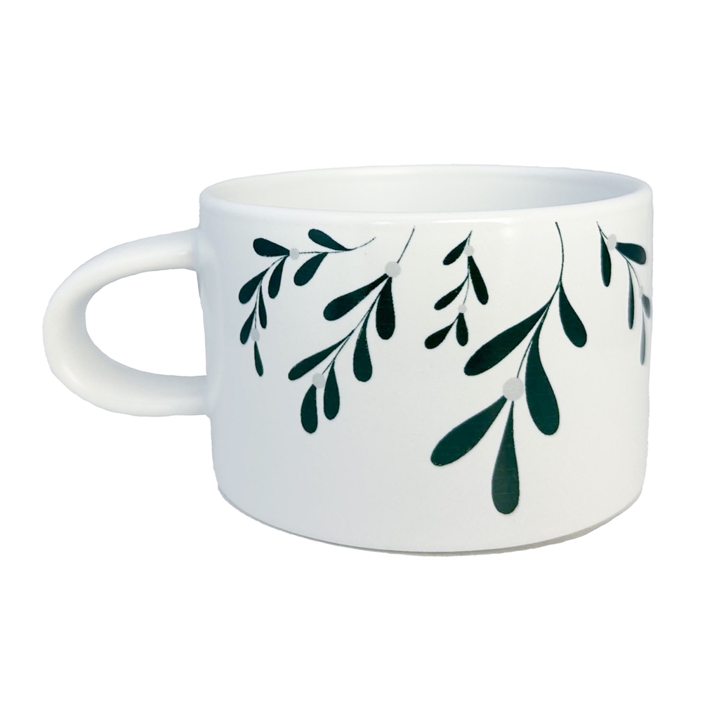 White mug with mistletoe decoration