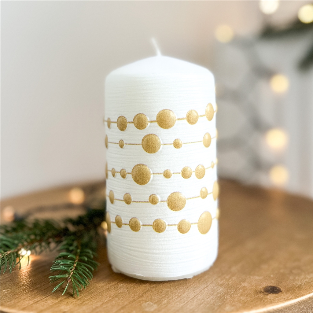 White candle with gold chain decor