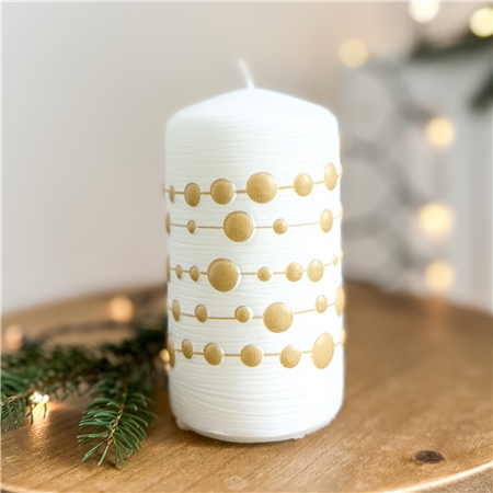 White candle with gold chain decor