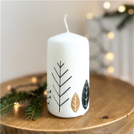 White candle with leaf decor