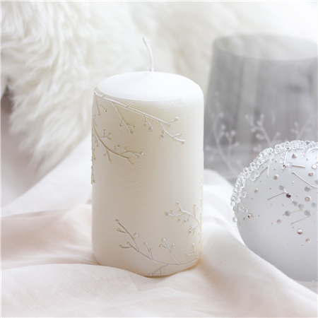 Candle with frosty twig decor