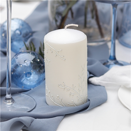 Candle with frosty twig decor