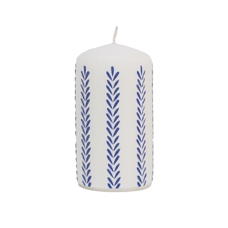 White candle with leaf decoration