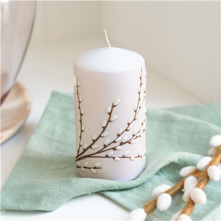 Pastel pink candle with cat decoration
