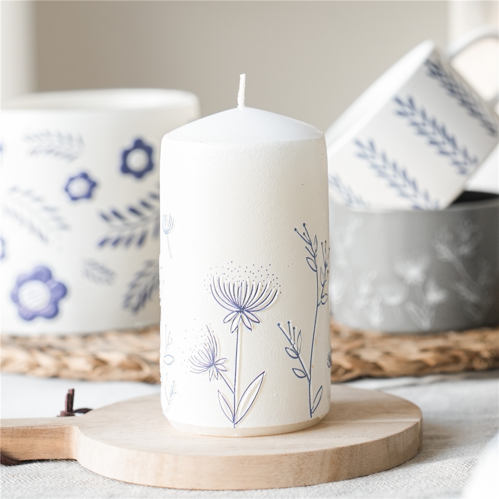 White candle with flower decoration