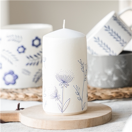 White candle with flower decoration