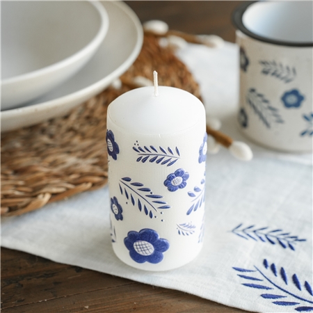 White candle with floral decoration