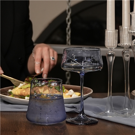 A set of blue cocktail glasses with frosty decor