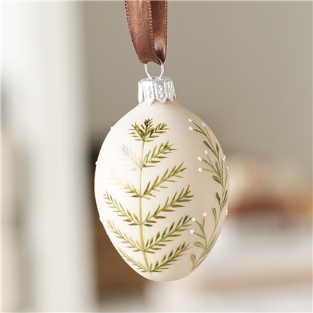 Beige Easter egg with plant