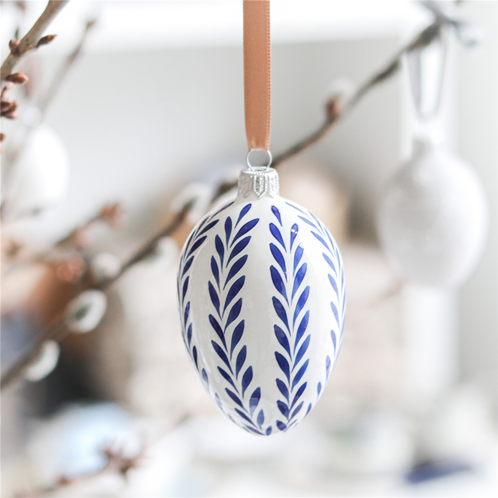 Easter egg with blue folkloric leafy decor 