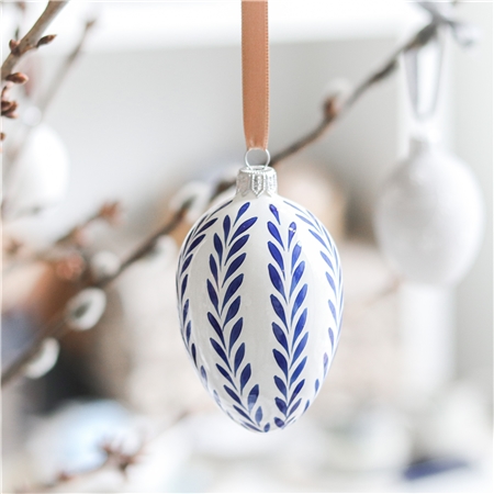 Easter egg with blue folkloric leafy decor 
