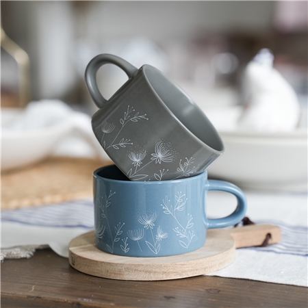 Blue mug with plant decoration