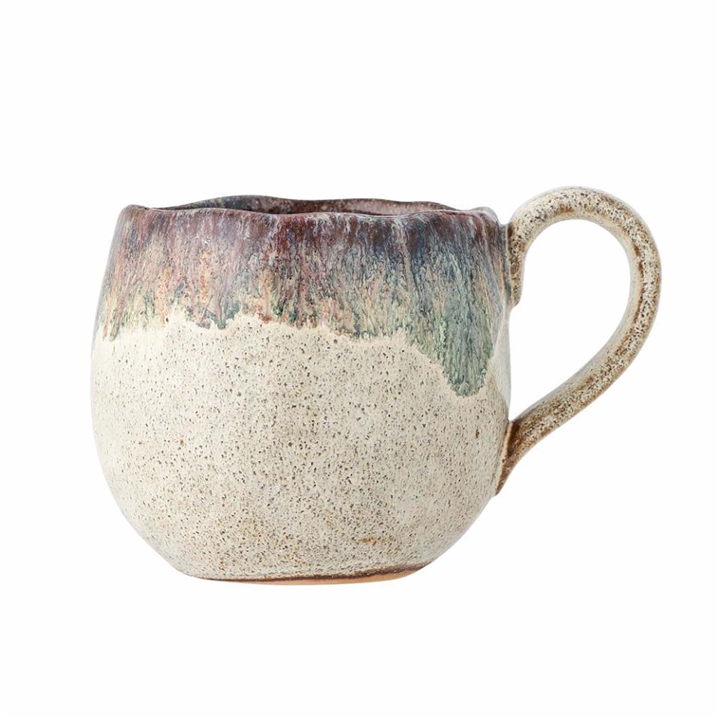 Stoneware mug with dripping glaze 