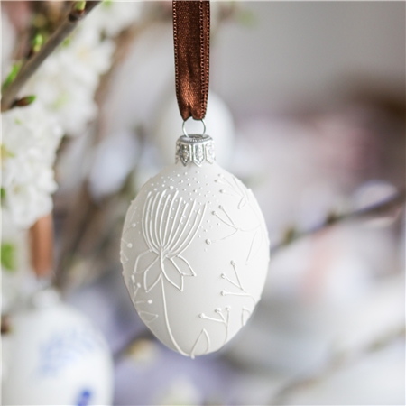 Matte white easter egg with plant decoration