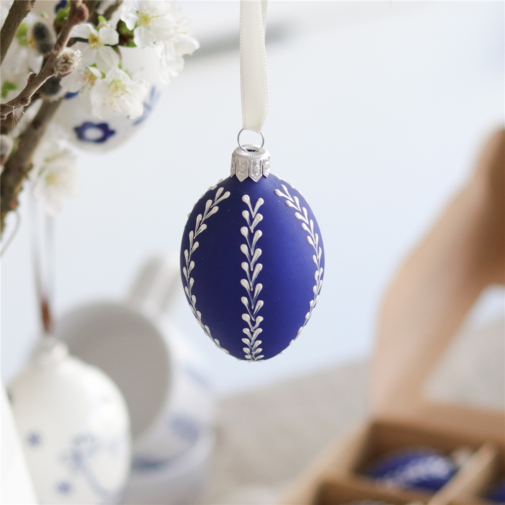 Frosted blue Easter egg with leaf decoration