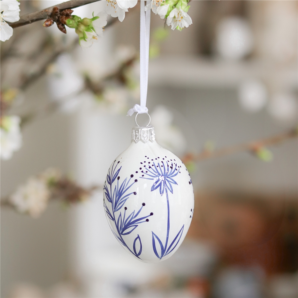 Porcelain white easter egg with plant decoration