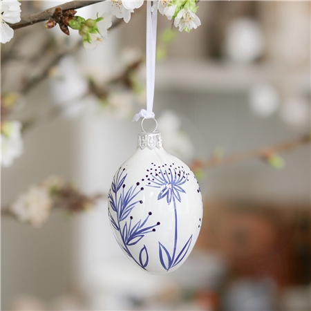 Porcelain white easter egg with plant decoration