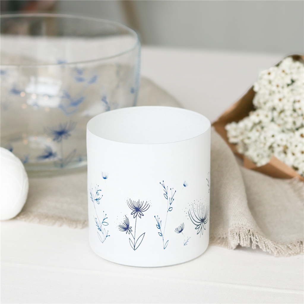 Glass candle holder with flower decoration