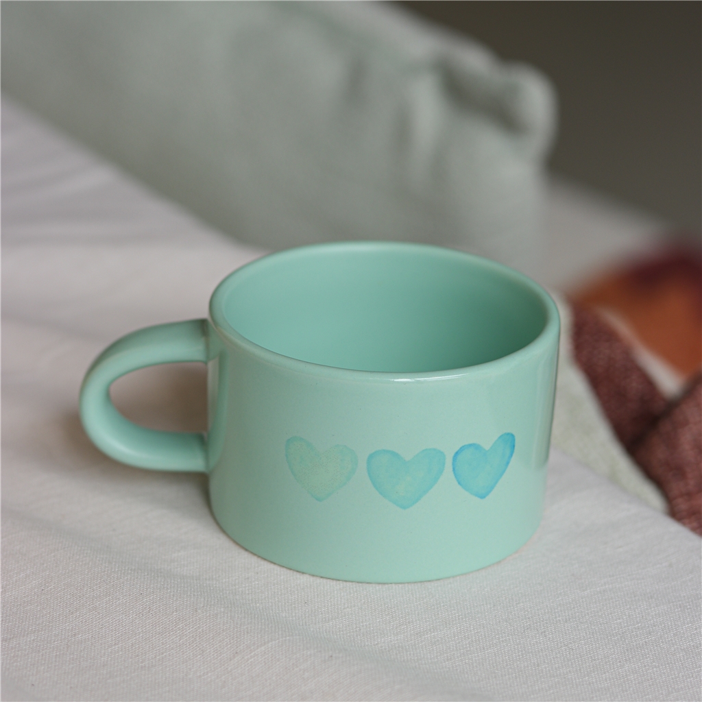 Pastel green mug with heart
