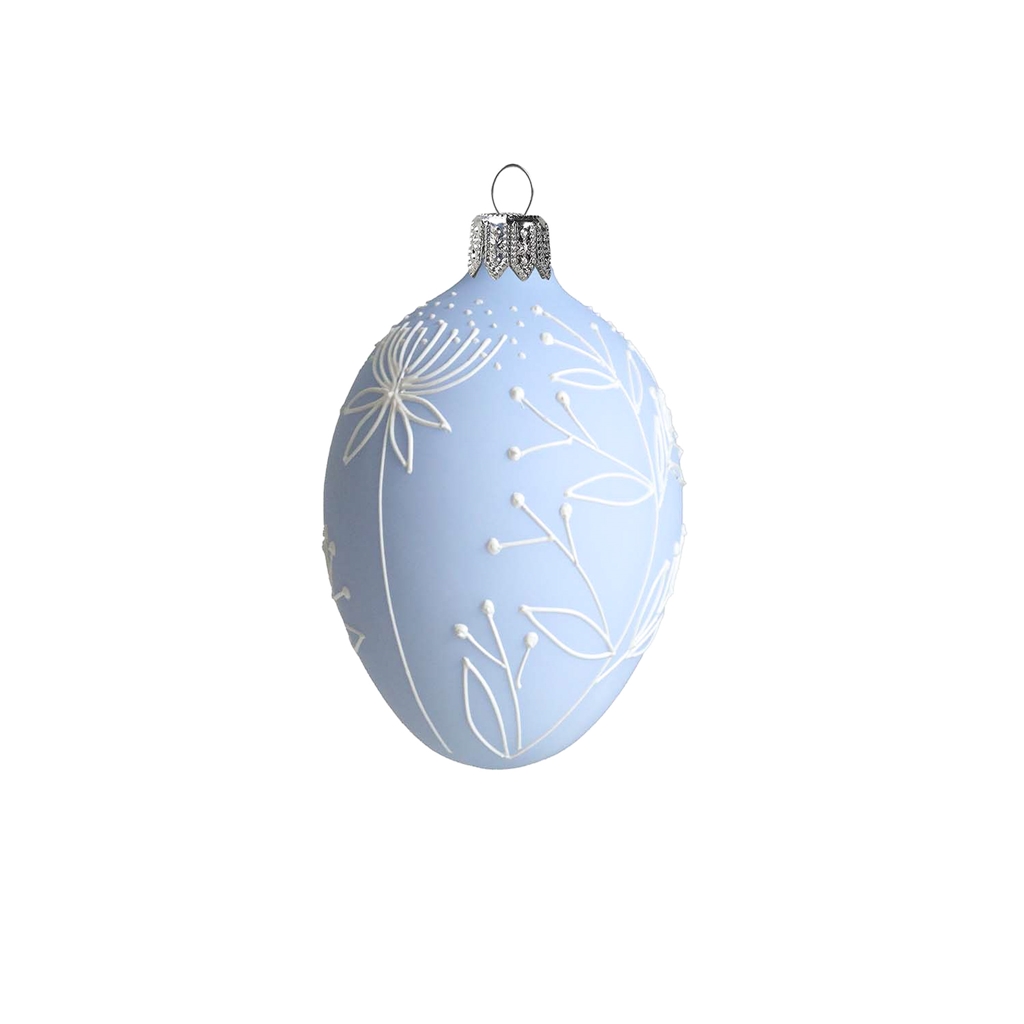 Easter egg with flower decoration in pastel blue